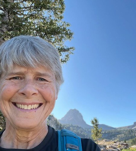 Barbara Nelson hiking in the mountains